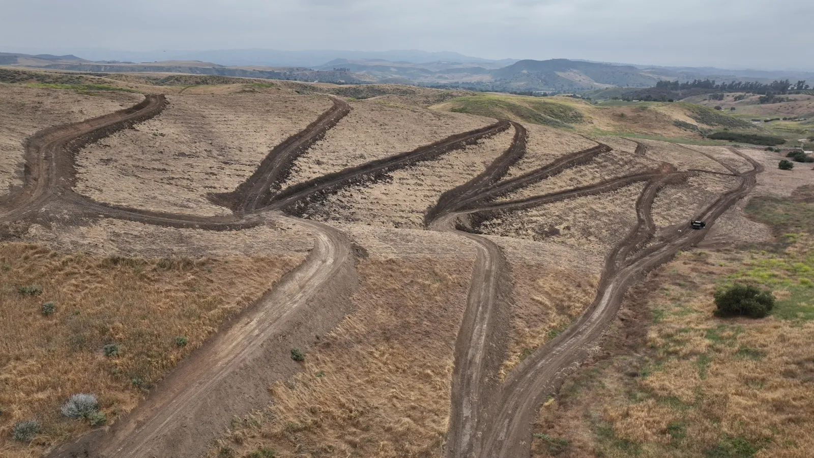 Aerial view of newly formed farm roads following the contours of rolling hills